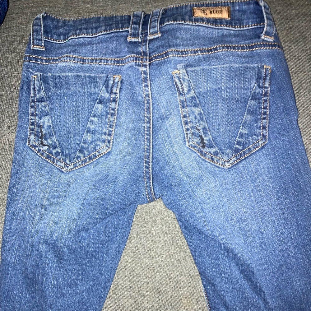 Blue jeans with rips